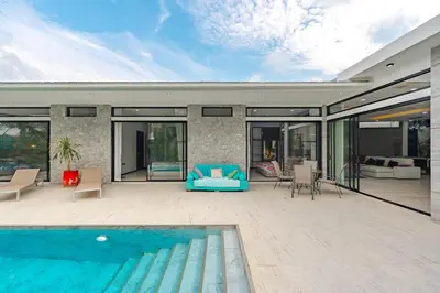 a house with a swimming pool and a patio at V204 Tropical Score 3BR with Pool, Tub & Snooker in Rawai Beach