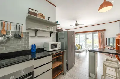 a kitchen with a counter top with a microwave at V205 Island Hideaway Near Promthep Sunset in Nai Harn Beach