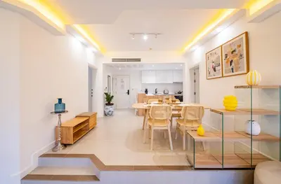 a dining room and living room with a table and chairs at JSD Prime Property-Cherngtalay in Laguna Phuket