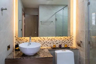 a bathroom with a sink and a shower and a toilet at Calipso Garden 108 in Rawai Beach