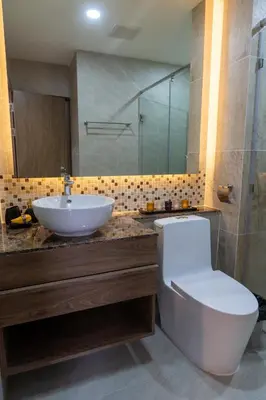 a bathroom with a toilet and a sink at Calipso Garden 108 in Rawai Beach