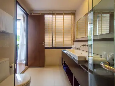 a kitchen with a sink and a toilet in it at Spacious 3 bedroom townhouse in Laguna in Laguna Phuket