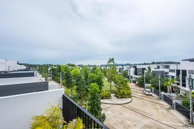 an apartment balcony with a view of a parking lot at Spacious 3 bedroom townhouse in Laguna in Laguna Phuket