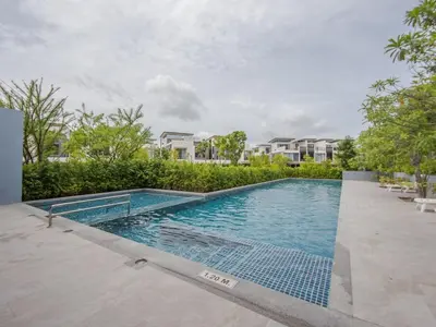 a swimming pool in the middle of a house at Spacious 3 bedroom townhouse in Laguna in Laguna Phuket