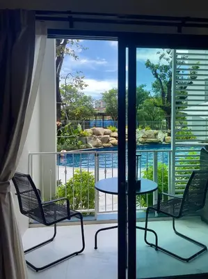 a balcony with two chairs and a table with a view at JU3 Halo NEW ВатСaп66935B2I976 in Nai Yang Beach