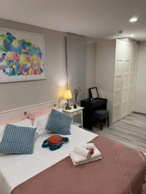 a bedroom with a large bed with towels on it at The title Naiyang - Beach Condos in Nai Yang Beach