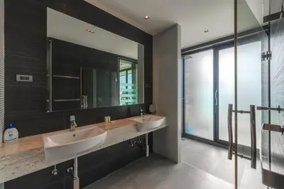 a bathroom with two sinks and a large mirror at V203 Seahorse Villa Stunning 4BR Oceanview Retreat in Bang Tao Beach