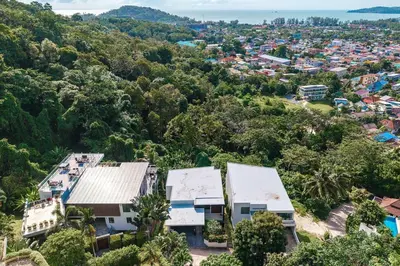 an aerial view of a town with trees and buildings at V203 Seahorse Villa Stunning 4BR Oceanview Retreat in Bang Tao Beach