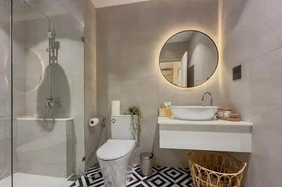 a bathroom with a toilet and a sink and a mirror at TheTitleHalo1 in Phuket
