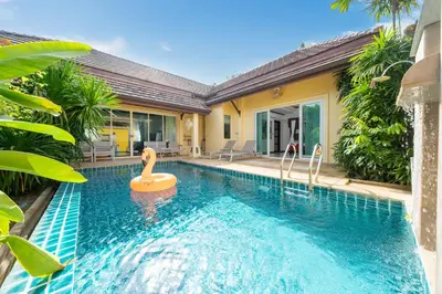 a pool with a swan in the middle of a house at Villa Prima - 3 Bedroom Private Pool Villa in Rawai Beach