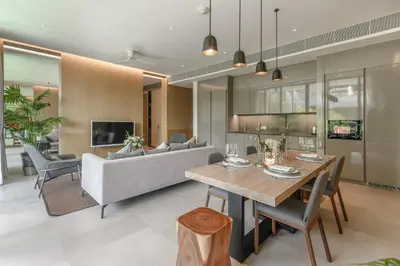 a living room with a table and a couch at JSD Prime Property-Kamala Beach in Surin Beach