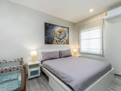a bedroom with a bed and a television in it at А4 Title 2-bedroom 86м2 ВатСaп66935B2I976 in Nai Yang Beach