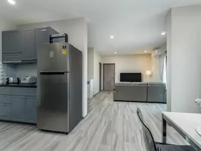 a kitchen with a refrigerator in the middle of a room at А4 Title 2-bedroom 86м2 ВатСaп66935B2I976 in Nai Yang Beach