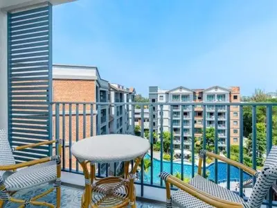 a balcony with a table and chairs and a pool at А4 Title 2-bedroom 86м2 ВатСaп66935B2I976 in Nai Yang Beach