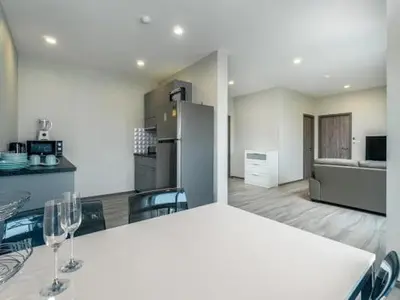 a kitchen with a white table and two wine glasses at А4 Title 2-bedroom 86м2 ВатСaп66935B2I976 in Nai Yang Beach