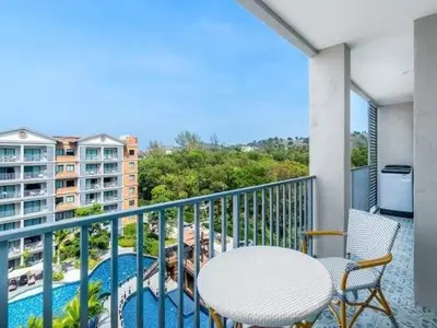 a balcony with a table and chairs and a pool at А4 Title 2-bedroom 86м2 ВатСaп66935B2I976 in Nai Yang Beach