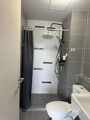 a bathroom with a shower with a toilet and a sink at dcondo Mine Phuket in Kathu