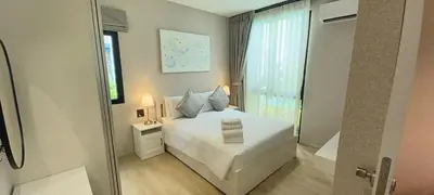 a bedroom with a white bed and a window at SA1 Halo1 NEW ВатСaп66935B2I976 in Nai Yang Beach