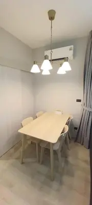 a dining room with a wooden table and chairs at SA1 Halo1 NEW ВатСaп66935B2I976 in Nai Yang Beach