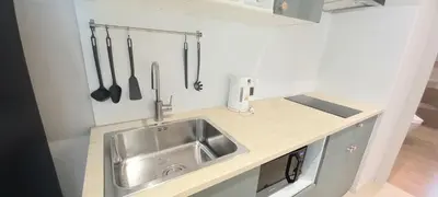 a kitchen with a sink and utensils on the wall at SA1 Halo1 NEW ВатСaп66935B2I976 in Nai Yang Beach