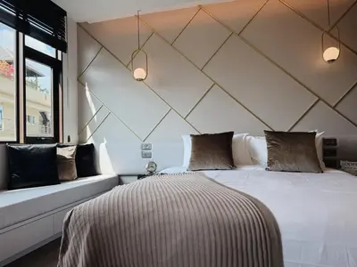 a bedroom with a large bed and a window at Proud Karon 303 in Karon Beach
