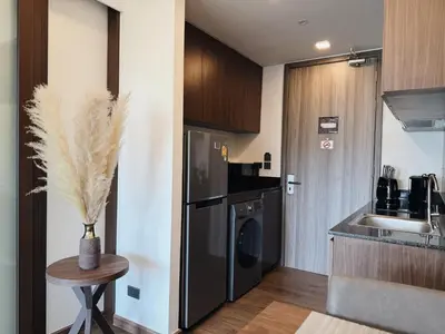 a small kitchen with a sink and a refrigerator at Proud Karon 303 in Karon Beach