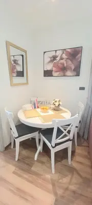 a white table and chairs in a room at MO1 Halo 2-bedroom ВатСaп66935B2I976 in Nai Yang Beach