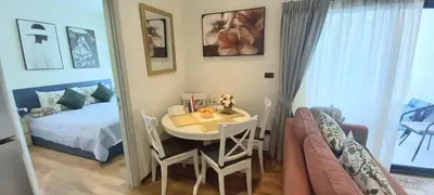 a small room with a table and a bed at MO1 Halo 2-bedroom ВатСaп66935B2I976 in Nai Yang Beach