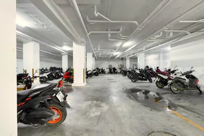 a parking lot with a bunch of motorcycles parked in it at Room 303 Rawai Beach Condo in Nai Harn Beach