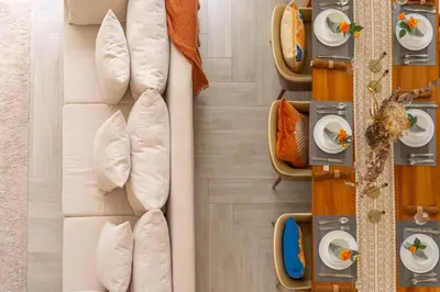 an overhead view of a dining room with white pillows at \u4e91\u6816\u522b\u9662 Cloudrest Villa in Phuket Town