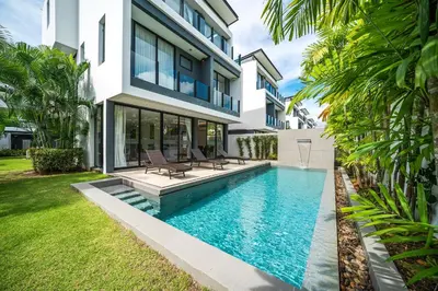 a swimming pool in the backyard of a house at Modern Minimalist 6 Bedroom Light Luxury Villa Private Pool Golf Course Laguna Park in Bang Tao Beach