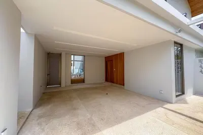 an empty living room with white walls and windows at Brand-New 3BR Designer Pool Villa in Exclusive Residence LuxPride 4 L20 in Bang Tao Beach