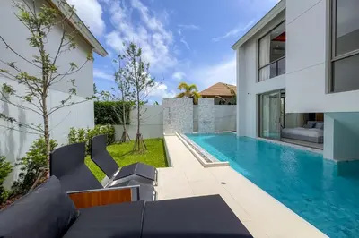 a swimming pool in the backyard of a house at Brand-New 3BR Designer Pool Villa in Exclusive Residence LuxPride 4 L20 in Bang Tao Beach