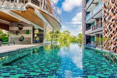 a swimming pool in the middle of a building at Tropical Retreat near Patong - Emerald Hill 420 in Patong Beach