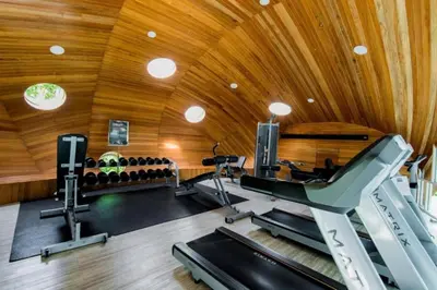an office with a gym with a treadmill and treadles at Tropical Retreat near Patong - Emerald Hill 420 in Patong Beach