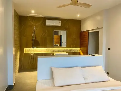 a bathroom with a sink and a mirror at Viewpoint Villa with Private Infinity Pool - 2BR in Rawai Beach