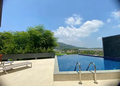 a swimming pool with a view of a mountain at Viewpoint Villa with Private Infinity Pool - 2BR in Rawai Beach