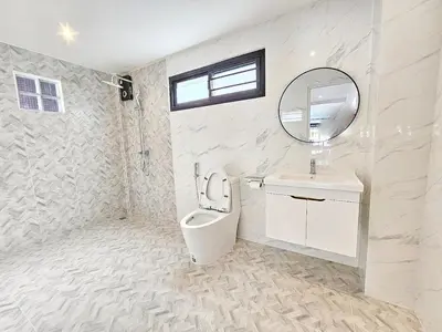 a bathroom with a toilet and a sink and a mirror at Modern 2 Bedroom Pool Villa in Kamala in Kamala Beach