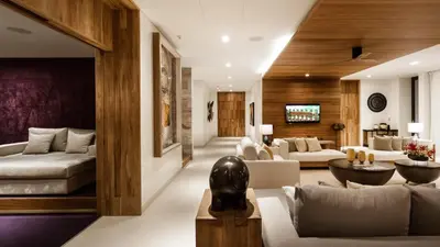 a living room with a couch and a table at Villa Amarapura in Ko Lek