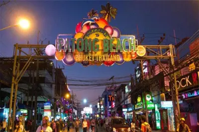 a busy city street at night with a neon sign at 1Br Horizon Suite at Patong - Emerald Hill 421 in Patong Beach