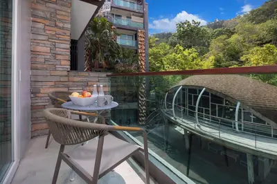 a balcony with a table with a bowl of fruit on it at 1Br Horizon Suite at Patong - Emerald Hill 421 in Patong Beach