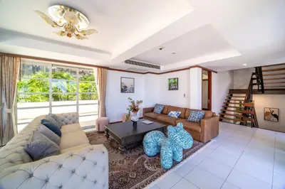 a living room with a couch and a table at Villa Seadream -Kata SeaView Villa-5 Mins to Beach best location in Phuket Town