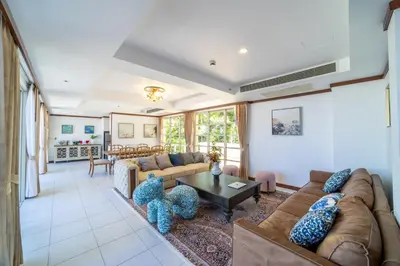 a living room with a couch and a table at Villa Seadream -Kata SeaView Villa-5 Mins to Beach best location in Phuket Town