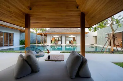 an external view of a villa with a swimming pool at Anchan Bangtao 4 Bedroom Pool Luxury Courtyard Villa in Phuket