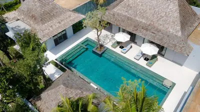 an aerial view of a villa with a swimming pool at Anchan Bangtao 4 Bedroom Pool Luxury Courtyard Villa in Phuket