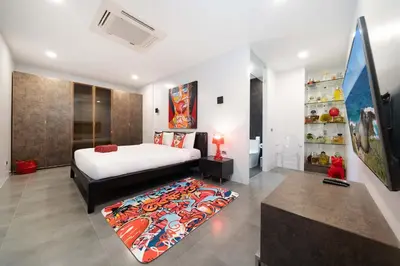 a bedroom with a bed and a rug at Unique Style & Comfort, 2BR Pool Villa DannyLys, near Nai Harn in Rawai Beach