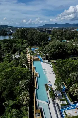 an aerial view of a large swimming pool at a resort at Cozy 1 BR beachfront apartment in Bang Tao Beach