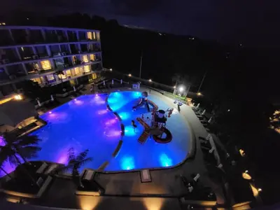an overhead view of a swimming pool at night at La Vita Rawai 1 Bdr Roof Pool in Rawai Beach