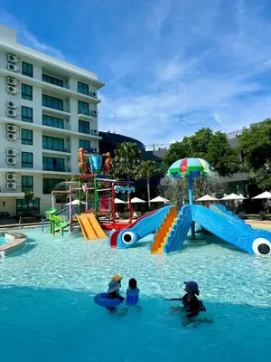 a group of people in the water at a water park at La Vita Rawai 1 Bdr Roof Pool in Rawai Beach