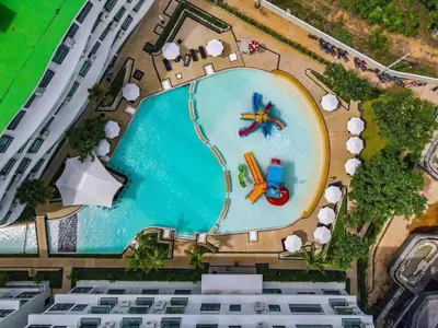 an overhead view of a pool with a toy airplane in it at La Vita Rawai 1 Bdr Roof Pool in Rawai Beach